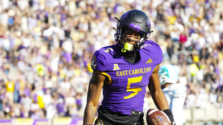 Nov 4, 2023; Greenville, North Carolina, USA;  East Carolina Pirates wide receiver Chase Sowell (5) reacts to his catch against the Tulane Green Wave during the first half at Dowdy-Ficklen Stadium. Mandatory Credit: James Guillory-Imagn Images