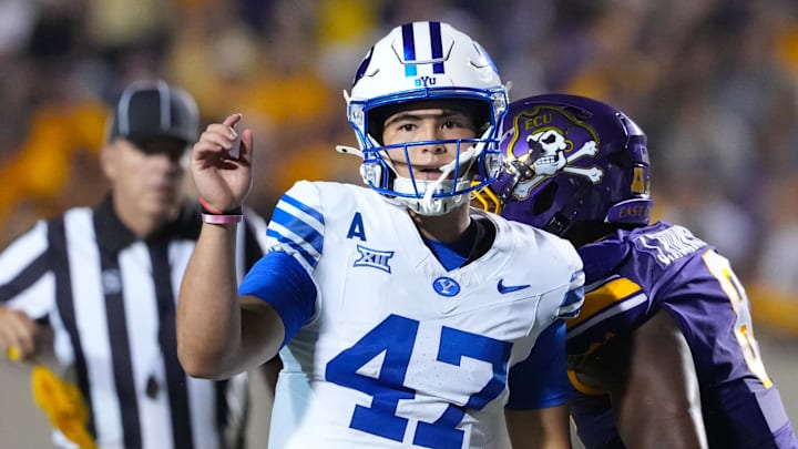 Sep 20, 2025; Greenville, North Carolina, USA;  Brigham Young Cougars quarterback Bear Bachmeier (47) watches his pass against the East Carolina Pirates during the second half at Dowdy-Ficklen Stadium. Mandatory Credit: James Guillory-Imagn Images