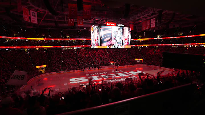 Apr 20, 2026; Raleigh, North Carolina, USA; Carolina Hurricanes fans get ready for the game before playing the Ottawa Senators in game two of the first round of the 2026 Stanley Cup Playoffs at Lenovo Center. Mandatory Credit: James Guillory-Imagn Images