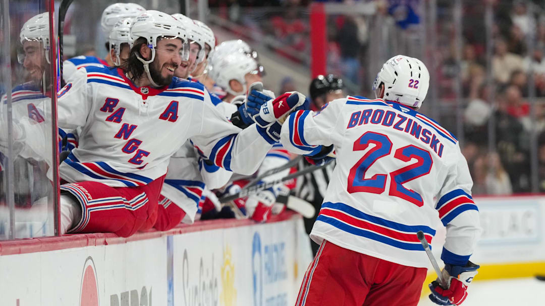 Dec 29, 2025; Raleigh, North Carolina, USA;  New York Rangers center Jonny Brodzinski (22) celebrates his goal with center Mika Zibanejad (93) against the Carolina Hurricanes during the second period at Lenovo Center. Mandatory Credit: James Guillory-Imagn Images
