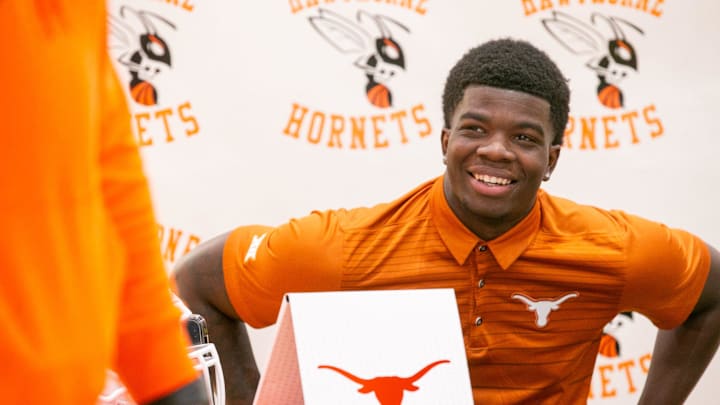 Jerrick Gibson signs his letter of intent to play football at Texas at Hawthorne Middle/High School in Hawthorne, FL on Thursday, December 21, 2023. [Alan Youngblood/Gainesville Sun]