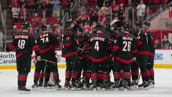 Apr 2, 2026; Raleigh, North Carolina, USA;  Carolina Hurricanes players celebrate their victory against the Columbus Blue Jackets at Lenovo Center. Mandatory Credit: James Guillory-Imagn Images