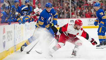 Nov 8, 2025; Raleigh, North Carolina, USA;  Buffalo Sabres center Tage Thompson (72) skates with the puck against Carolina Hurricanes left wing Jordan Martinook (48) during the second period at Lenovo Center. Mandatory Credit: James Guillory-Imagn Images