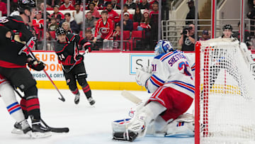 Nov 26, 2025; Raleigh, North Carolina, USA; Carolina Hurricanes center Seth Jarvis (24) scores a goal past New York Rangers goaltender Igor Shesterkin (31) during the third period at Lenovo Center. Mandatory Credit: James Guillory-Imagn Images