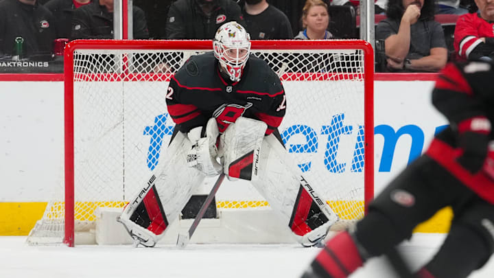 Mar 28, 2026; Raleigh, North Carolina, USA;  Carolina Hurricanes goaltender Brandon Bussi (32) looks on against the New Jersey Devils at Lenovo Center. Mandatory Credit: James Guillory-Imagn Images