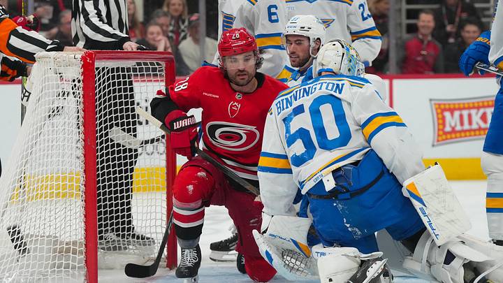 Mar 12, 2026; Raleigh, North Carolina, USA;  Carolina Hurricanes left wing William Carrier (28) looks on next to St. Louis Blues goaltender Jordan Binnington (50) during the first period at Lenovo Center. Mandatory Credit: James Guillory-Imagn Images
