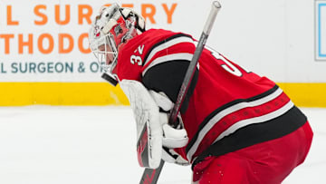 Dec 9, 2025; Raleigh, North Carolina, USA;  Carolina Hurricanes goaltender Brandon Bussi (32) makes a save against the Columbus Blue Jackets during the second period at Lenovo Center. Mandatory Credit: James Guillory-Imagn Images