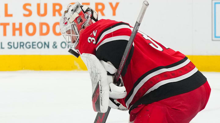 Dec 9, 2025; Raleigh, North Carolina, USA;  Carolina Hurricanes goaltender Brandon Bussi (32) makes a save against the Columbus Blue Jackets during the second period at Lenovo Center. Mandatory Credit: James Guillory-Imagn Images