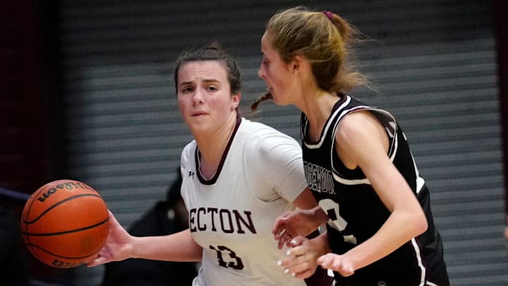 Katie Reiner of Becton (13) dribbles up court as Katie Adams of Ridgewood defends on Jan. 30, 2025.