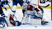 Apr 23, 2024; Winnipeg, Manitoba, CAN; Colorado Avalanche defenseman Josh Manson (42) and goalie Alexander Georgiev (40) search for the puck against the Winnipeg Jets during the second period in game two of the first round of the 2024 Stanley Cup Playoffs at Canada Life Centre. Mandatory Credit: Terrence Lee-Imagn Images