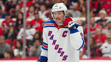 Nov 26, 2025; Raleigh, North Carolina, USA; New York Rangers center J.T. Miller (8) reacts against the Carolina Hurricanes during the third period at Lenovo Center. Mandatory Credit: James Guillory-Imagn Images