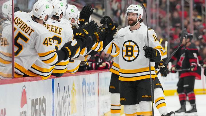 Apr 7, 2026; Raleigh, North Carolina, USA;  Boston Bruins center Pavel Zacha (18) celebrates his goal against the Carolina Hurricanes during the third period at Lenovo Center. Mandatory Credit: James Guillory-Imagn Images