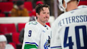 Jan 10, 2025; Raleigh, North Carolina, USA;  Vancouver Canucks center J.T. Miller (9) looks on during the warmups before the game against the Carolina Hurricanes at Lenovo Center. Mandatory Credit: James Guillory-Imagn Images