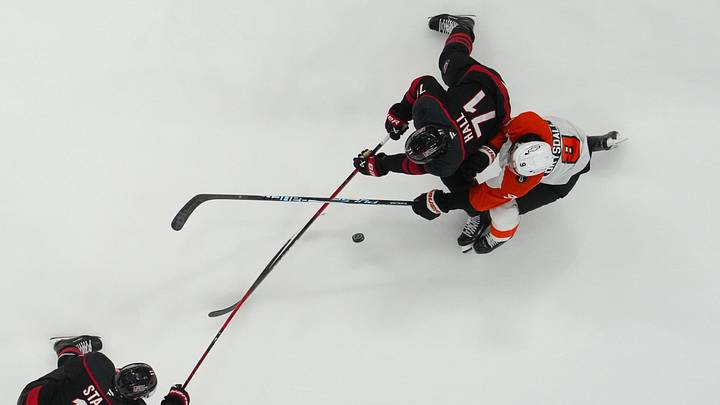 May 4, 2026; Raleigh, North Carolina, USA; IPhiladelphia Flyers defenseman Jamie Drysdale (9) and Carolina Hurricanes left wing Taylor Hall (71) skate after the puck during the second period n game two of the second round of the 2026 Stanley Cup Playoffs at Lenovo Center. Mandatory Credit: James Guillory-Imagn Images