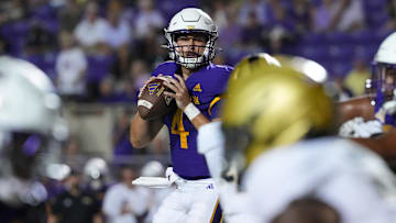 Sep 25, 2025; Greenville, North Carolina, USA;  East Carolina Pirates quarterback Katin Houser (4) looks to throw the ball against the Army Black Knights during the first half at Dowdy-Ficklen Stadium. Mandatory Credit: James Guillory-Imagn Images