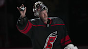 Nov 18, 2023; Raleigh, North Carolina, USA; Carolina Hurricanes goaltender Antti Raanta (32) celebrates their victory against the Pittsburgh Penguins at PNC Arena. Mandatory Credit: James Guillory-Imagn Images