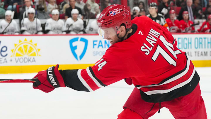 Feb 1, 2026; Raleigh, North Carolina, USA;  Carolina Hurricanes defenseman Jaccob Slavin (74) takes a shot during the third period against the Los Angeles Kings at Lenovo Center. Mandatory Credit: James Guillory-Imagn Images