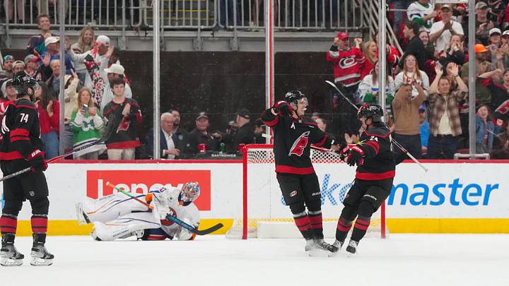Apr 4, 2026; Raleigh, North Carolina, USA;  Carolina Hurricanes center Sebastian Aho (20) is congratulated by center Seth Jarvis (24) after his goal past New York Islanders goaltender Ilya Sorokin (30) during the second period at Lenovo Center. Mandatory Credit: James Guillory-Imagn Images