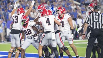 Sep 14, 2024; Lexington, Kentucky, USA; Georgia Bulldogs running back Branson Robinson (22) celebrates with teammates after he scores a touchdown during the fourth quarter against the Kentucky Wildcats at Kroger Field. Mandatory Credit: Tanner Pearson-Imagn Images