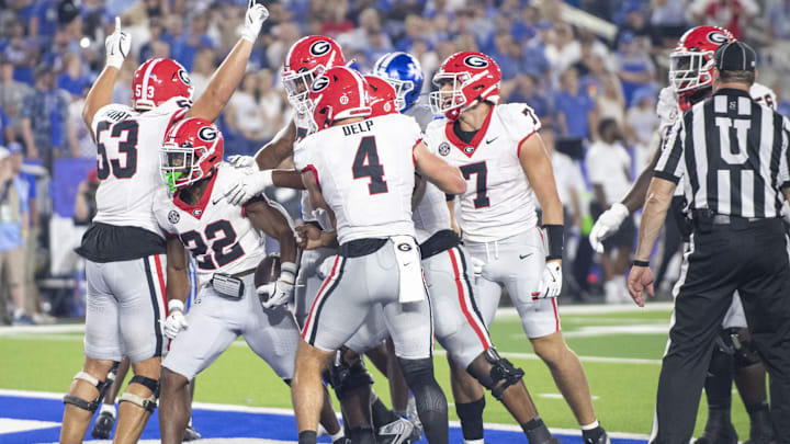 Sep 14, 2024; Lexington, Kentucky, USA; Georgia Bulldogs running back Branson Robinson (22) celebrates with teammates after he scores a touchdown during the fourth quarter against the Kentucky Wildcats at Kroger Field. Mandatory Credit: Tanner Pearson-Imagn Images