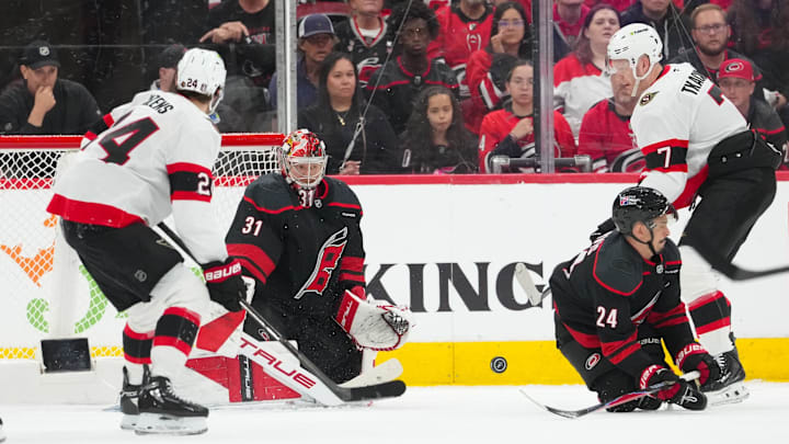 Apr 18, 2026; Raleigh, North Carolina, USA; Carolina Hurricanes center Seth Jarvis (24) with goaltender Frederik Andersen (31) go to block the shot by Ottawa Senators left wing Brady Tkachuk (7) during the third period in game one of the first round of the 2026 Stanley Cup Playoffs at Lenovo Center. Mandatory Credit: James Guillory-Imagn Images
