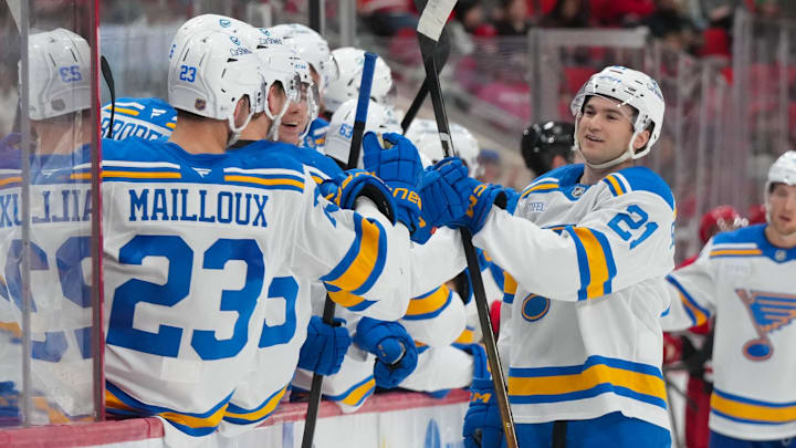 Mar 12, 2026; Raleigh, North Carolina, USA;  St. Louis Blues right wing Jimmy Snuggerud (21) celebrates his goal against the Carolina Hurricanes during the third period at Lenovo Center. Mandatory Credit: James Guillory-Imagn Images