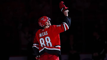 Nov 17, 2024; Raleigh, North Carolina, USA;  Carolina Hurricanes center Martin Necas (88) celebrates the win after the game against the St. Louis Blues at Lenovo Center. Mandatory Credit: James Guillory-Imagn Images