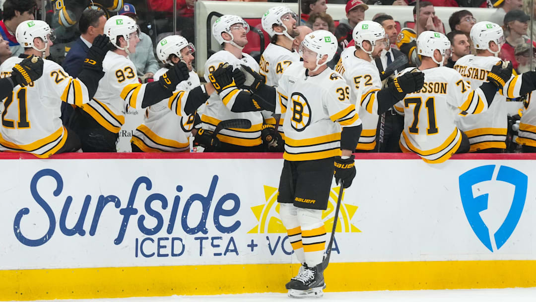 Apr 7, 2026; Raleigh, North Carolina, USA; Boston Bruins center Morgan Geekie (39) celebrates his goal against the Carolina Hurricanes during the first period at Lenovo Center. Mandatory Credit: James Guillory-Imagn Images Apr 7, 2026; Raleigh, North Carolina, USA; Boston Bruins center Morgan Geekie (39) celebrates his goal against the Carolina Hurricanes during the first period at Lenovo Center. Mandatory Credit: James Guillory-Imagn Images