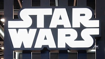 Visitors are seen at Disney's Star Wars booth during the Ani...