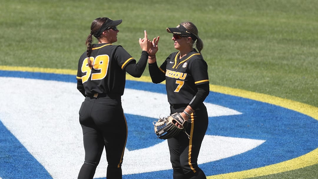 May 6, 2025; Athens, GA, USA; Missouri utility Kayley Lenger (99) and Missouri catcher Stefania Abruscato (7) shake hands during a game against Ole Miss at Jack Turner Softball Stadium. Mandatory Credit: Mady Mertens-Imagn Images