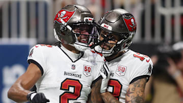 Sep 7, 2025; Atlanta, Georgia, USA; Tampa Bay Buccaneers wide receiver Emeka Egbuka (2) celebrates with wide receiver Mike Evans (13) after scoring a touchdown against the Atlanta Falcons during the second quarter at Mercedes-Benz Stadium. Mandatory Credit: Brett Davis-Imagn Images