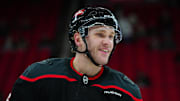 Mar 6, 2025; Raleigh, North Carolina, USA;  Carolina Hurricanes right wing Mikko Rantanen (96) looks on during the warmups before the game against the Boston Bruins at Lenovo Center. Mandatory Credit: James Guillory-Imagn Images