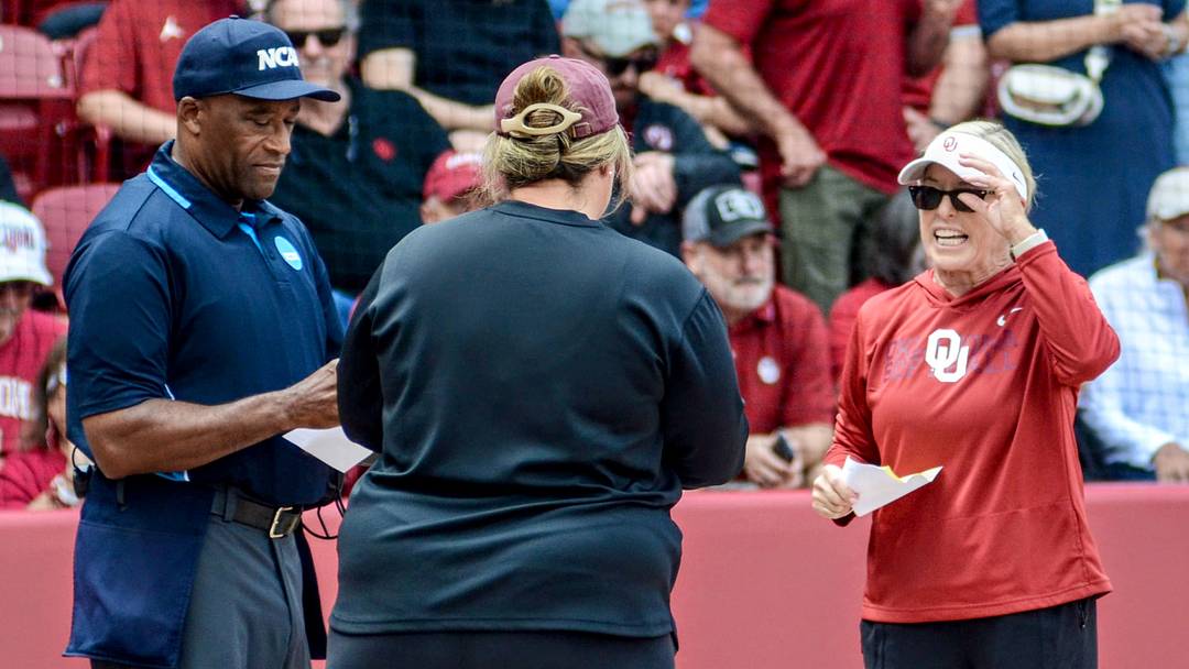Oklahoma coach Patty Gasso exchanges lineup cards with Mississippi State coach Samantha Ricketts ahead of a game in the Norman Super Regional.