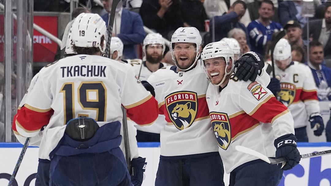 May 14, 2025; Toronto, Ontario, CAN; Florida Panthers defenseman Dmitry Kulikov (7) celebrates his goal against the Toronto Maple Leafs with defenseman Nate Schmidt (88) and forward Matthew Tkachuk (19) during the second period of game five of the second round of the 2025 Stanley Cup Playoffs at Scotiabank Arena. Mandatory Credit: John E. Sokolowski-Imagn Images