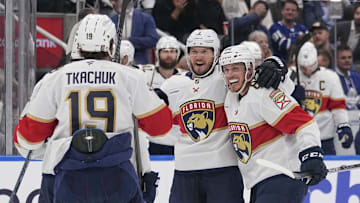 May 14, 2025; Toronto, Ontario, CAN; Florida Panthers defenseman Dmitry Kulikov (7) celebrates his goal against the Toronto Maple Leafs with defenseman Nate Schmidt (88) and forward Matthew Tkachuk (19) during the second period of game five of the second round of the 2025 Stanley Cup Playoffs at Scotiabank Arena. Mandatory Credit: John E. Sokolowski-Imagn Images