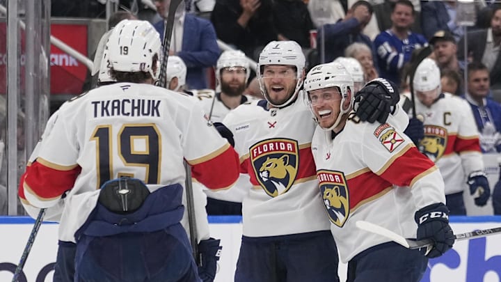 May 14, 2025; Toronto, Ontario, CAN; Florida Panthers defenseman Dmitry Kulikov (7) celebrates his goal against the Toronto Maple Leafs with defenseman Nate Schmidt (88) and forward Matthew Tkachuk (19) during the second period of game five of the second round of the 2025 Stanley Cup Playoffs at Scotiabank Arena. Mandatory Credit: John E. Sokolowski-Imagn Images