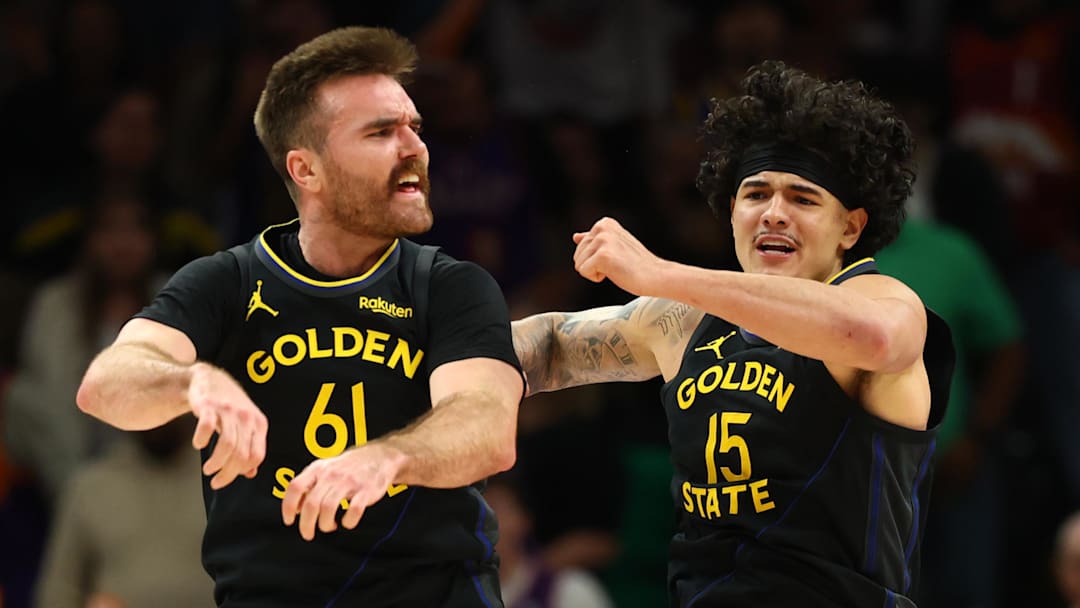 Feb 5, 2026; Phoenix, Arizona, USA; Golden State Warriors guard Pat Spencer (61) celebrates with forward Gui Santos (15) against the Phoenix Suns in the second half at Mortgage Matchup Center. Mandatory Credit: Mark J. Rebilas-Imagn Images