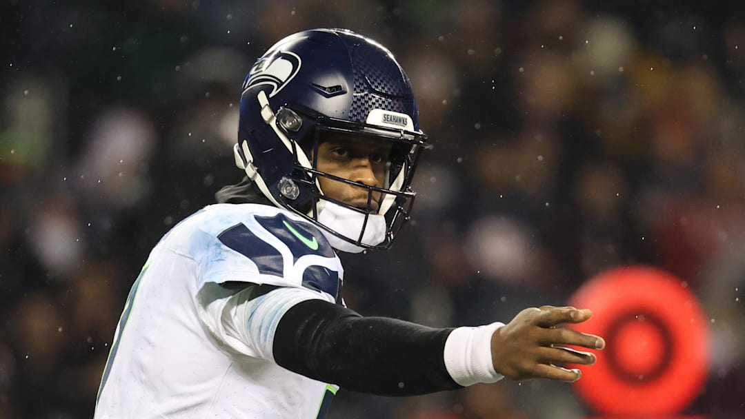 Dec 26, 2024; Chicago, Illinois, USA; Seattle Seahawks quarterback Geno Smith (7) directs a play prior to the snap during the fourth quarter against the Chicago Bears at Soldier Field. Mandatory Credit: Talia Sprague-Imagn Images