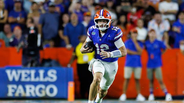 Sep 5, 2026; Gainesville, Florida, USA;  Florida Gators quarterback Aaron Philo (12) runs with the ball against the Florida Atlantic Owls during the first half at Ben Hill Griffin Stadium.  Mandatory Credit: Matt Pendleton-Imagn Images