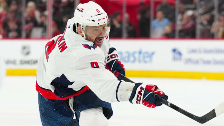 May 10, 2025; Raleigh, North Carolina, USA; Washington Capitals left wing Alex Ovechkin (8) takes a shot against the Carolina Hurricanes during the second period in game three of the second round of the 2025 Stanley Cup Playoffs at Lenovo Center. Mandatory Credit: James Guillory-Imagn Images