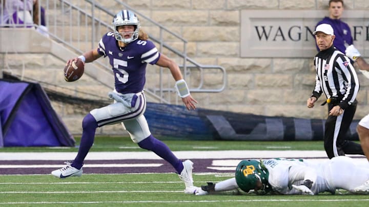 Nov 11, 2023; Manhattan, Kansas, USA; Kansas State Wildcats running back Treshaun Ward (9) runs away from Baylor Bears defensive lineman TJ Franklin (9) during the fourth quarter at Bill Snyder Family Football Stadium. Mandatory Credit: Scott Sewell-USA TODAY Sports