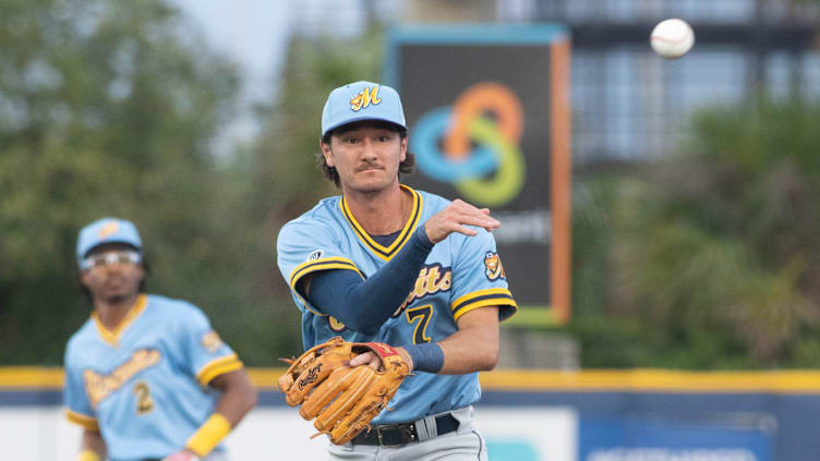 Second baseman Alika Williams (7) throws to first for an out during the Montgomery Biscuits vs