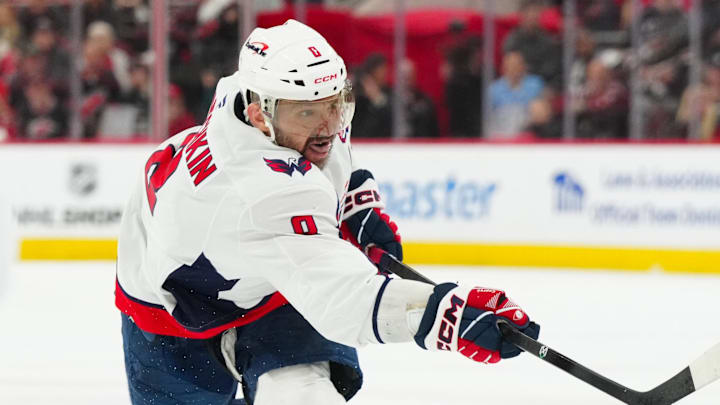 May 10, 2025; Raleigh, North Carolina, USA; Washington Capitals left wing Alex Ovechkin (8) takes a shot against the Carolina Hurricanes during the second period in game three of the second round of the 2025 Stanley Cup Playoffs at Lenovo Center. Mandatory Credit: James Guillory-Imagn Images