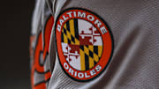 May 5, 2024; Cincinnati, Ohio, USA; The Baltimore Orioles logo on the sleeve of designated hitter Gunnar Henderson (2) as he prepares on deck during the seventh inning against the Cincinnati Reds at Great American Ball Park. Mandatory Credit: Katie Stratman-Imagn Images