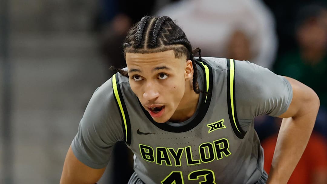 Jan 7, 2026; Waco, Texas, USA;  Baylor Bears guard Cameron Carr (43) controls the ball as Iowa State Cyclones guard Killyan Toure (27) defends during the second half at Paul and Alejandra Foster Pavilion. Mandatory Credit: Chris Jones-Imagn Images