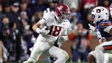 Nov 29, 2025; Auburn, Alabama, USA; Alabama Crimson Tide defensive back Bray Hubbard (18) intercepts the ball against Auburn Tigers running back Omar Mabson II (29) and quarterback Ashton Daniels (12) during the second half at Jordan-Hare Stadium. Mandatory Credit: John Reed-Imagn Images