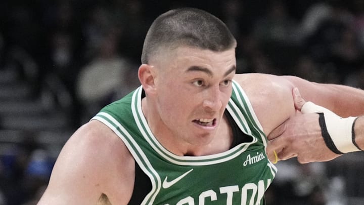 Mar 2, 2026; Milwaukee, Wisconsin, USA; Boston Celtics guard Payton Pritchard (11) drives to the basket against Milwaukee Bucks forward Pete Nance (35) in the second half at Fiserv Forum. Mandatory Credit: Michael McLoone-Imagn Images
