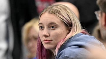 Nov 19, 2025; Dallas, Texas, USA; Dallas Wings point guard Paige Bueckers watches the game between the Dallas Mavericks and the New York Knicks during the second half at the American Airlines Center. Mandatory Credit: Jerome Miron-Imagn Images