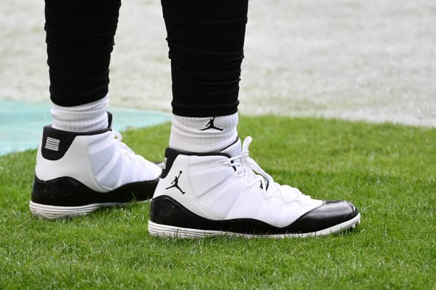 White and black Air Jordan cleats.