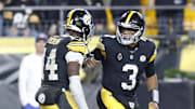 Oct 20, 2024; Pittsburgh, Pennsylvania, USA;  Pittsburgh Steelers wide receiver George Pickens (14) and Pittsburgh Steelers quarterback Russell Wilson (3) celebrate after combining for a touchdown against the New York Jets during the second quarter at Acrisure Stadium. Mandatory Credit: Charles LeClaire-Imagn Images